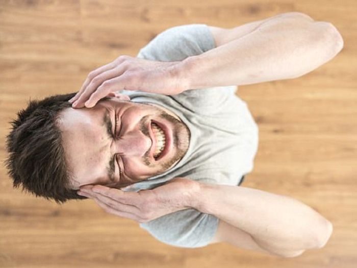 Triệu chứng đau đầu khi tập gym